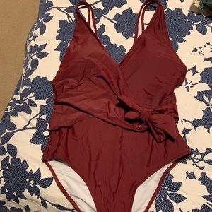Maroon one piece swim suit. Size Large.
